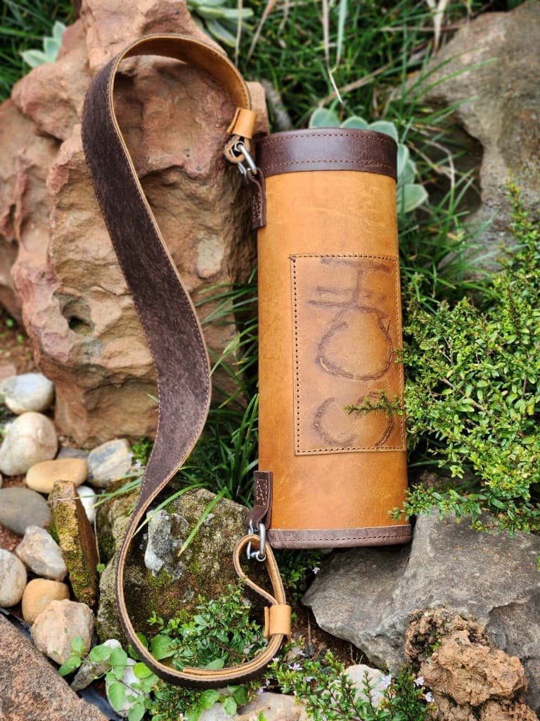 Handmade leather farm utility case with embossed patch and shoulder strap by Plaasjaap