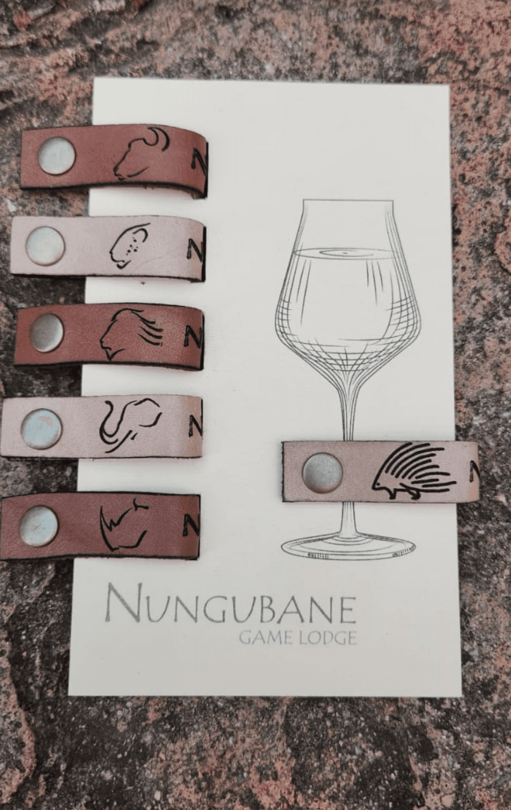 Handmade leather wine glass charms with wildlife silhouettes by Plaasjaap